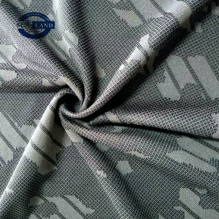 Person standing in a factory with machinery in the background