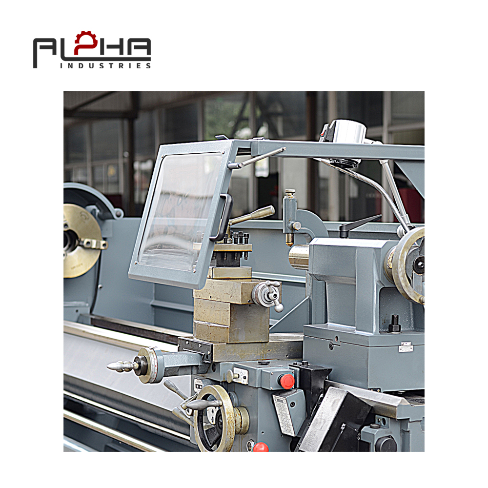 Person standing in a factory with machinery in the background