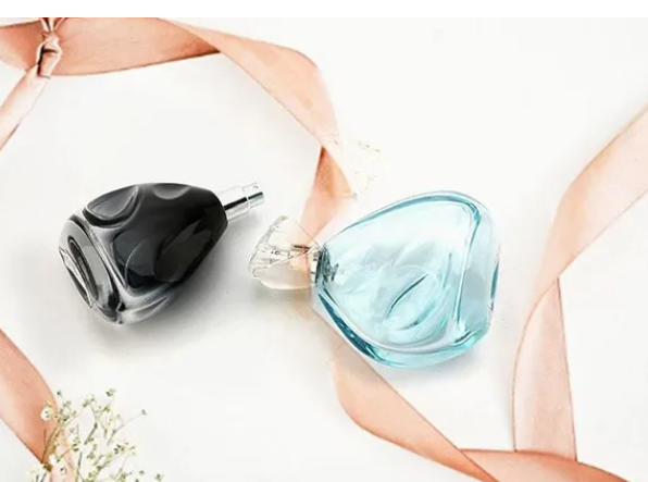 Person standing in a factory with machinery in the background