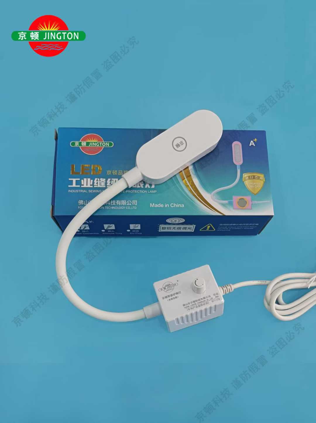 Person standing in a factory with machinery in the background