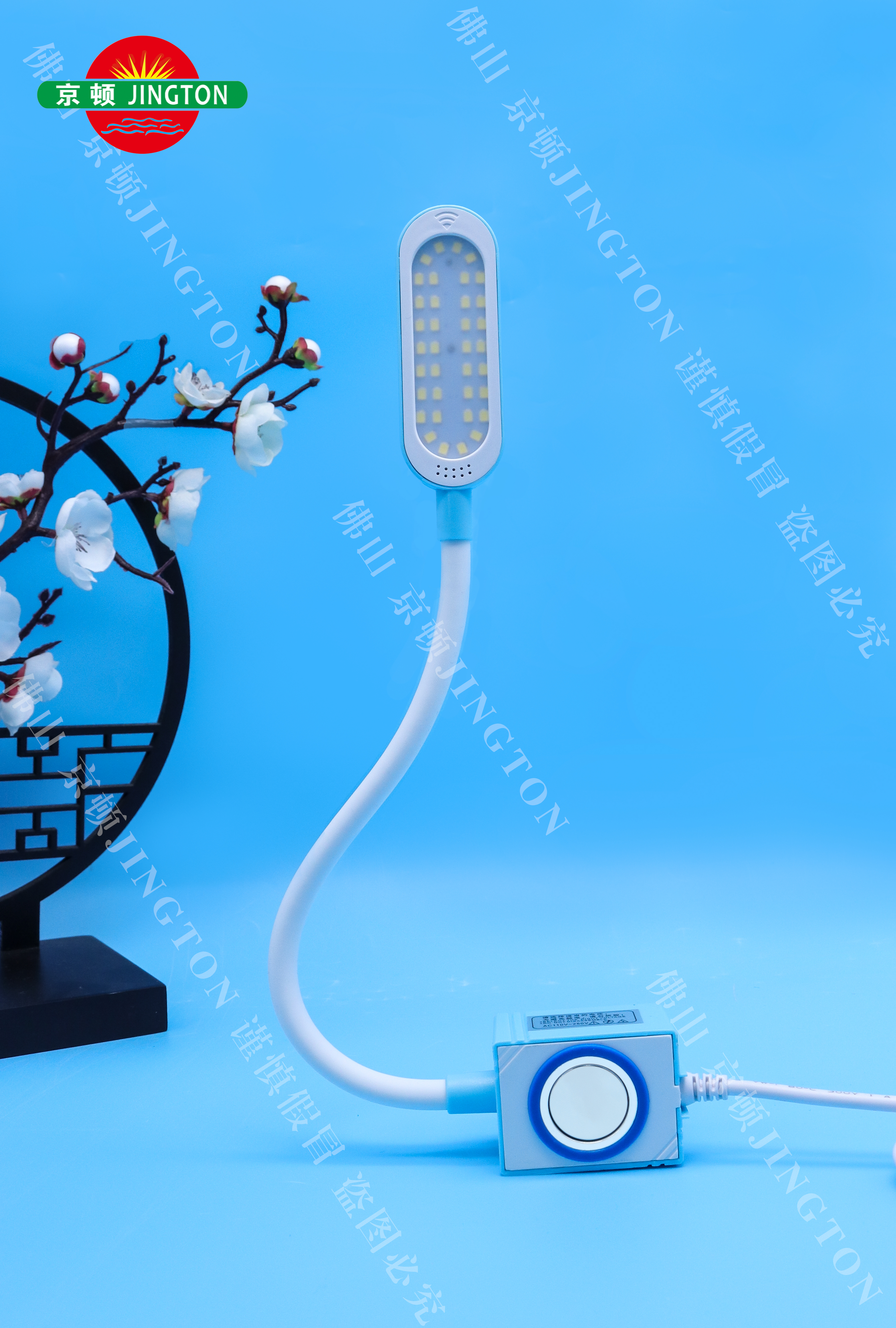 Person standing in a factory with machinery in the background