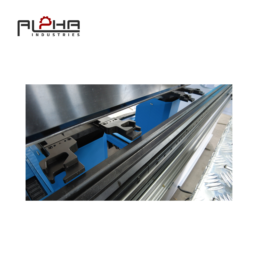 Person standing in a factory with machinery in the background