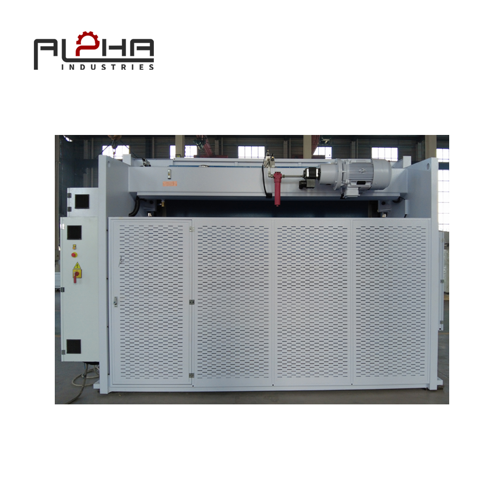 Person standing in a factory with machinery in the background