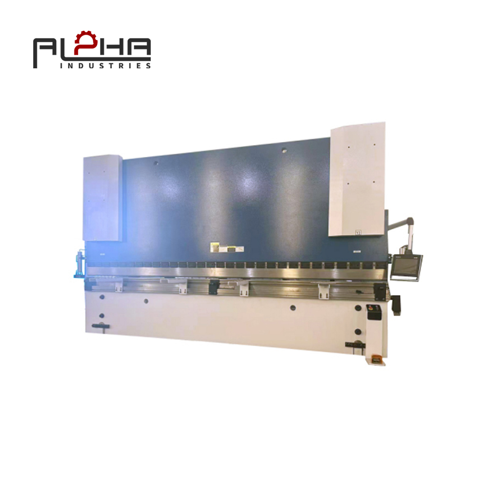 Person standing in a factory with machinery in the background