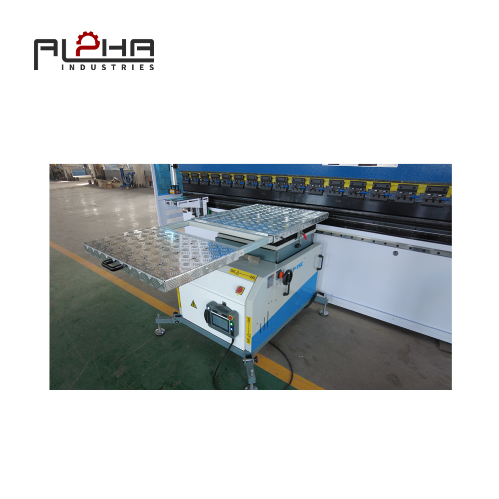 Person standing in a factory with machinery in the background