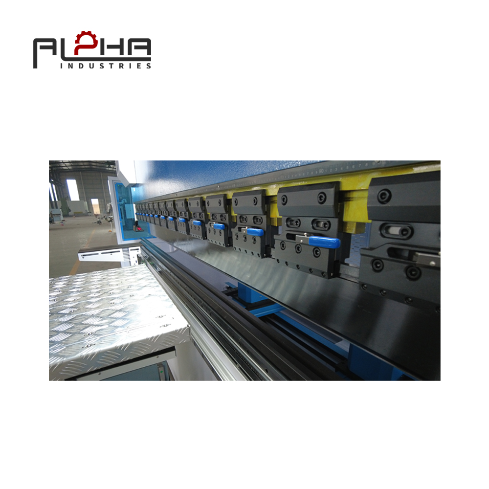 Person standing in a factory with machinery in the background