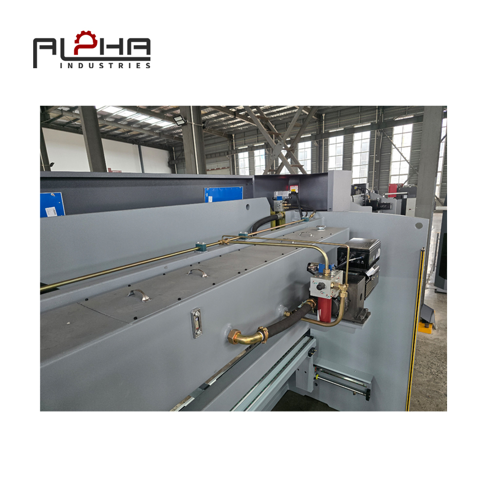 Person standing in a factory with machinery in the background