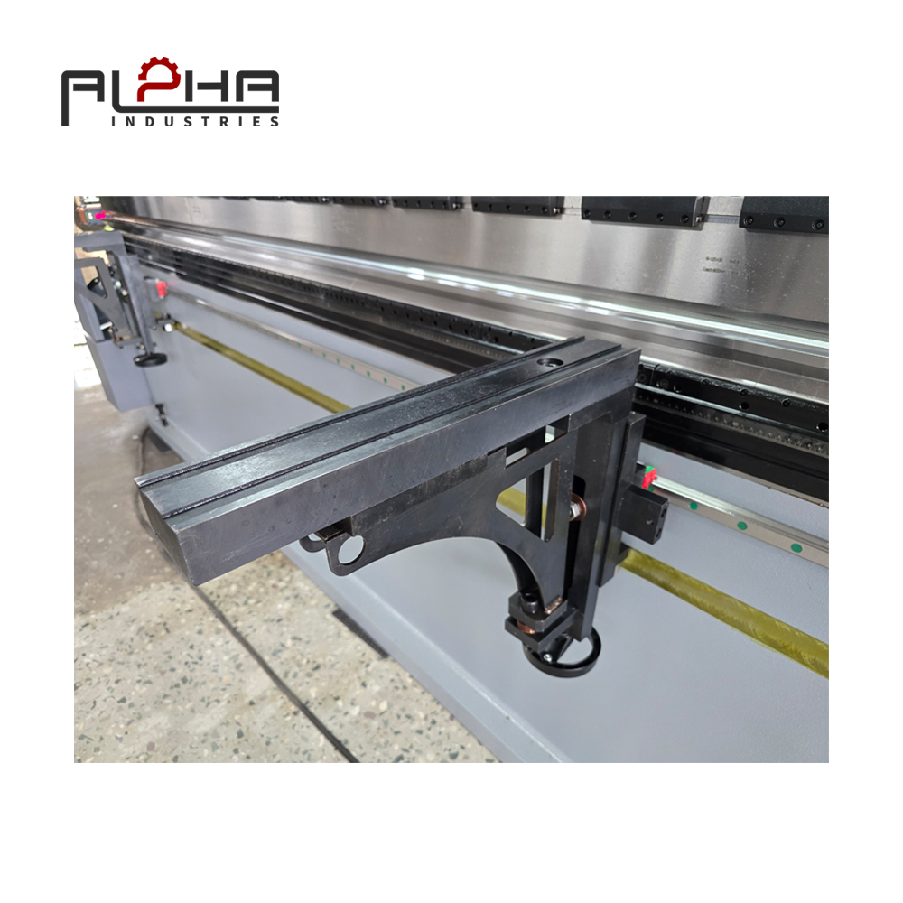 Person standing in a factory with machinery in the background