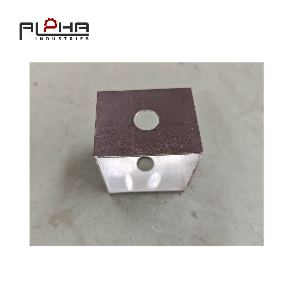 Person standing in a factory with machinery in the background