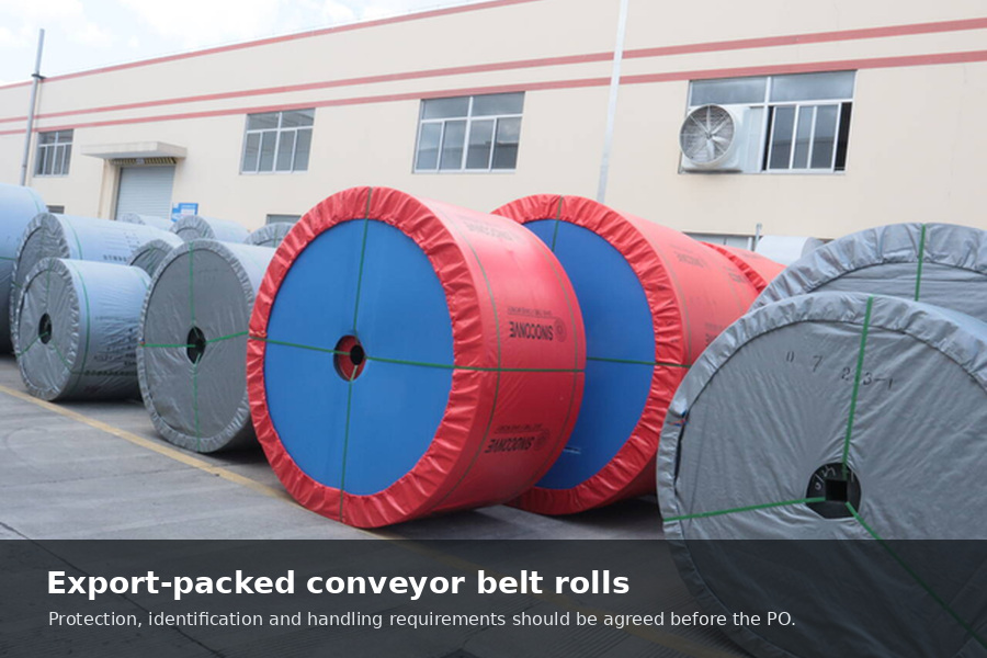 Export-packed conveyor belt rolls protected and strapped outside the factory before international shipment.