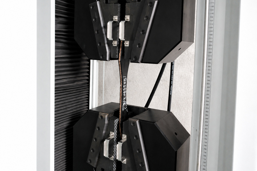 Conveyor belt tensile strength testing on a universal testing machine