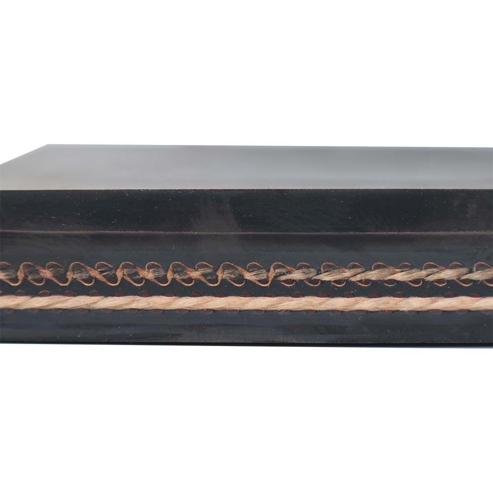 Cross section of a fabric conveyor belt showing multiple plies and rubber covers