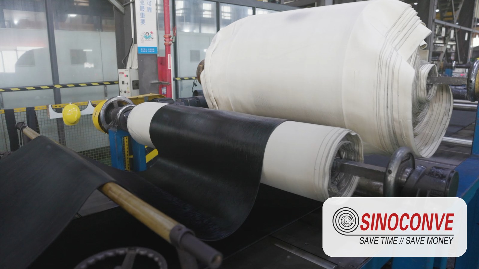 Fabric plies of a rubber conveyor belt over rollers