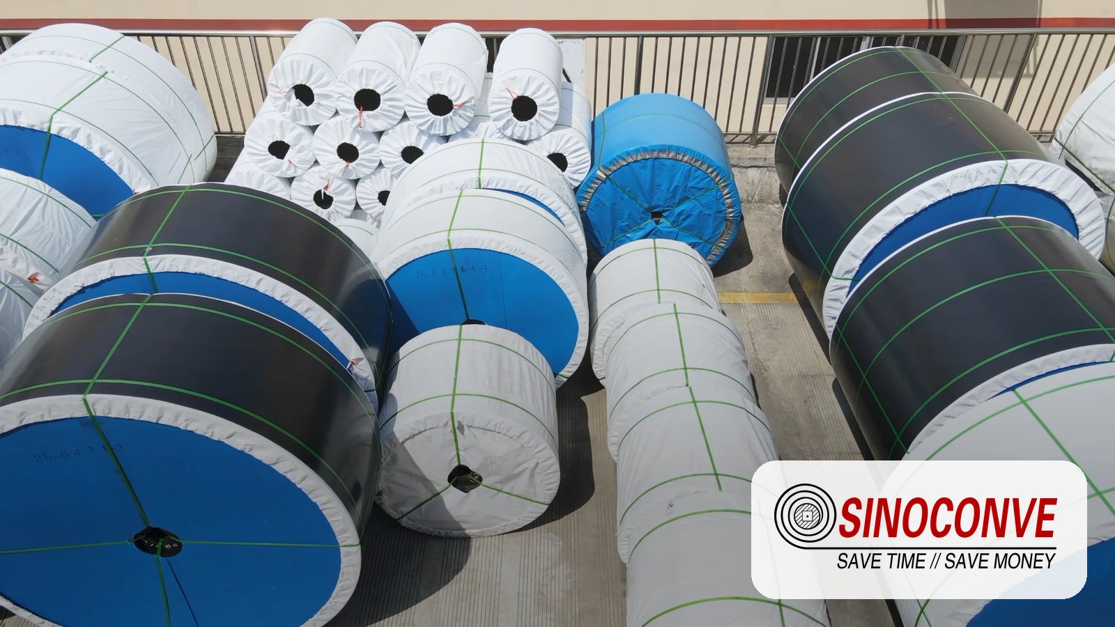PVC conveyor belt factory workshop with finished conveyor belt rolls ready for shipment at SINOCONVE