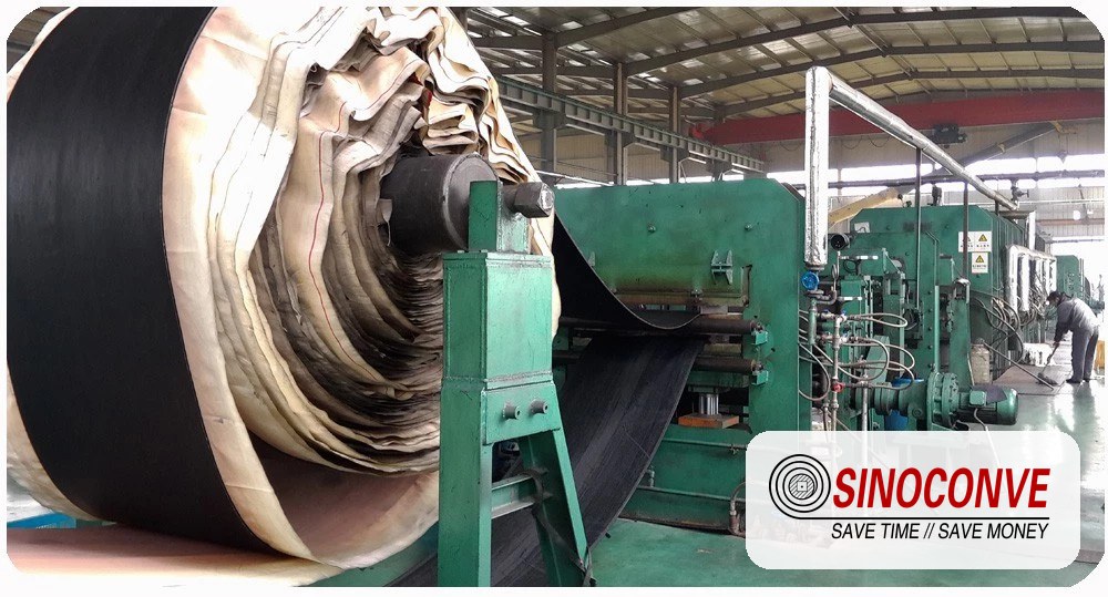 Carcass and cover layers of a multi ply rubber conveyor belt exposed during production