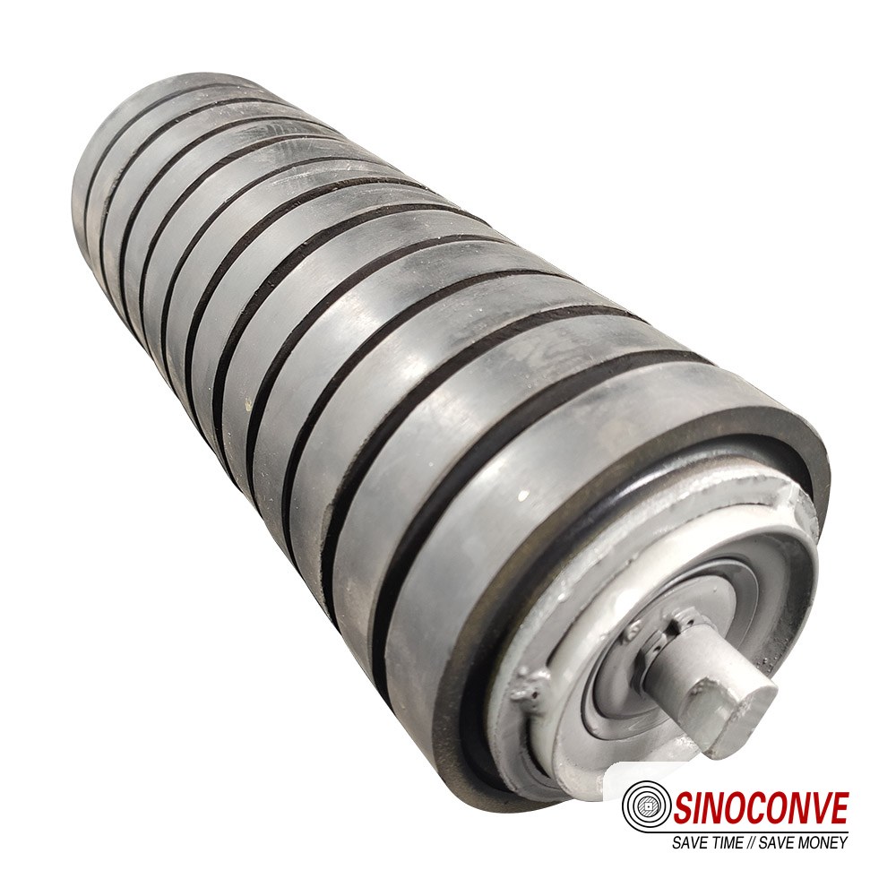 Spiral roller used on the return strand to shed sticky carryback