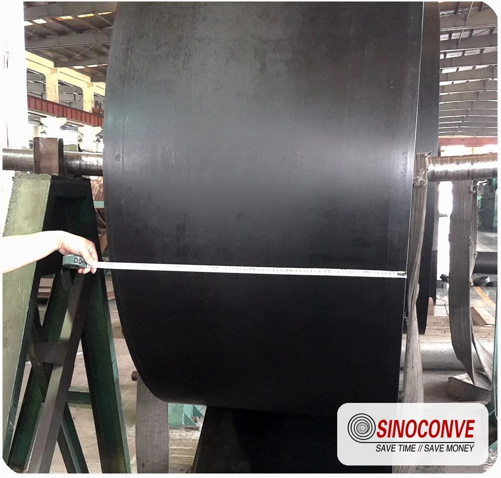 Cover and ply thickness checked with a steel rule on a finished belt roll before dispatch