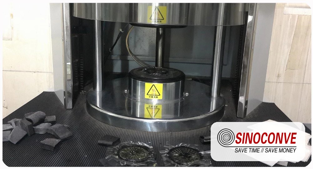 Hot vulcanizing press platens closing on a rubber conveyor belt splice sample in the SINOCONVE belt factory