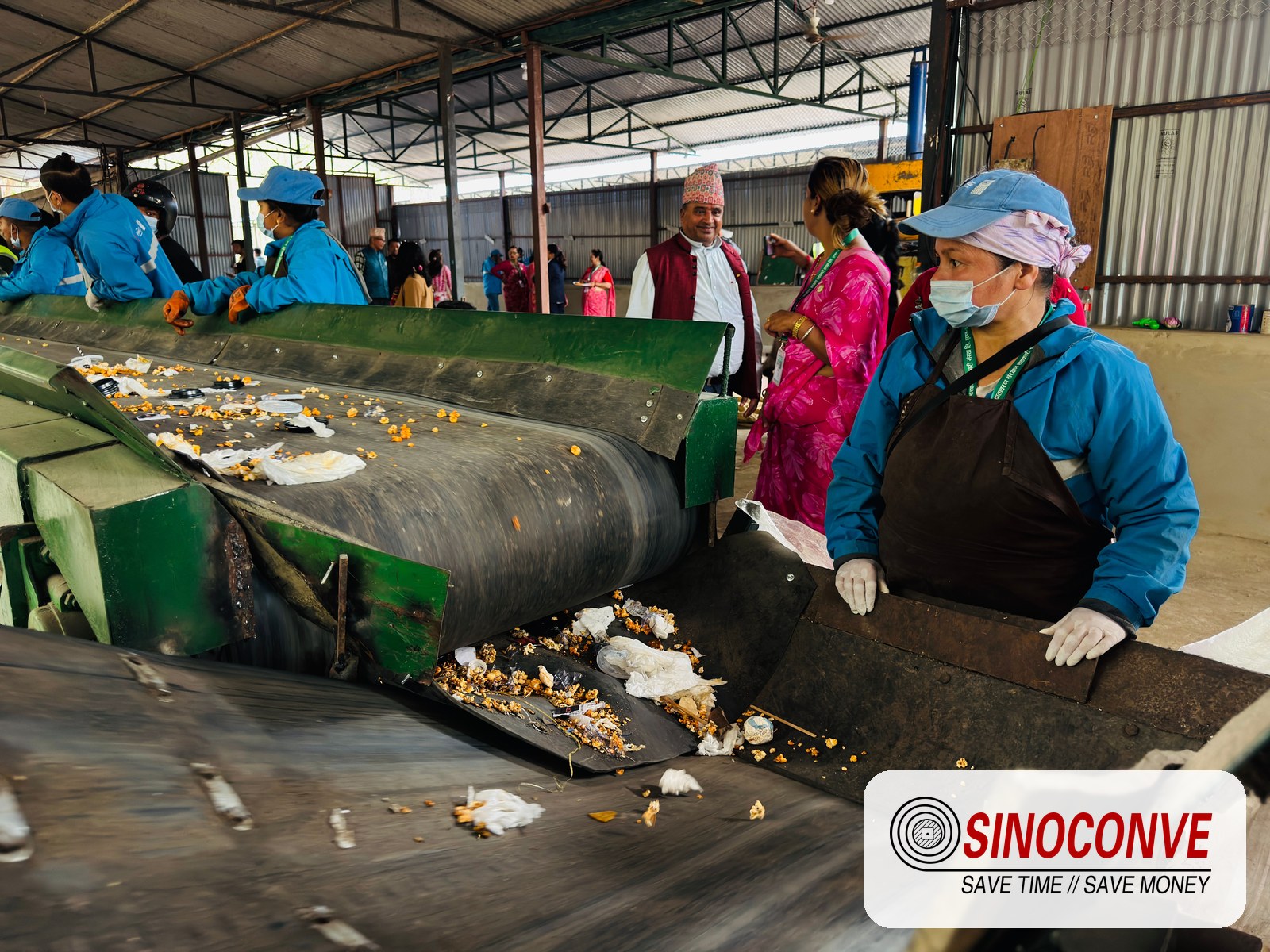 workers checking material on a conveyor line