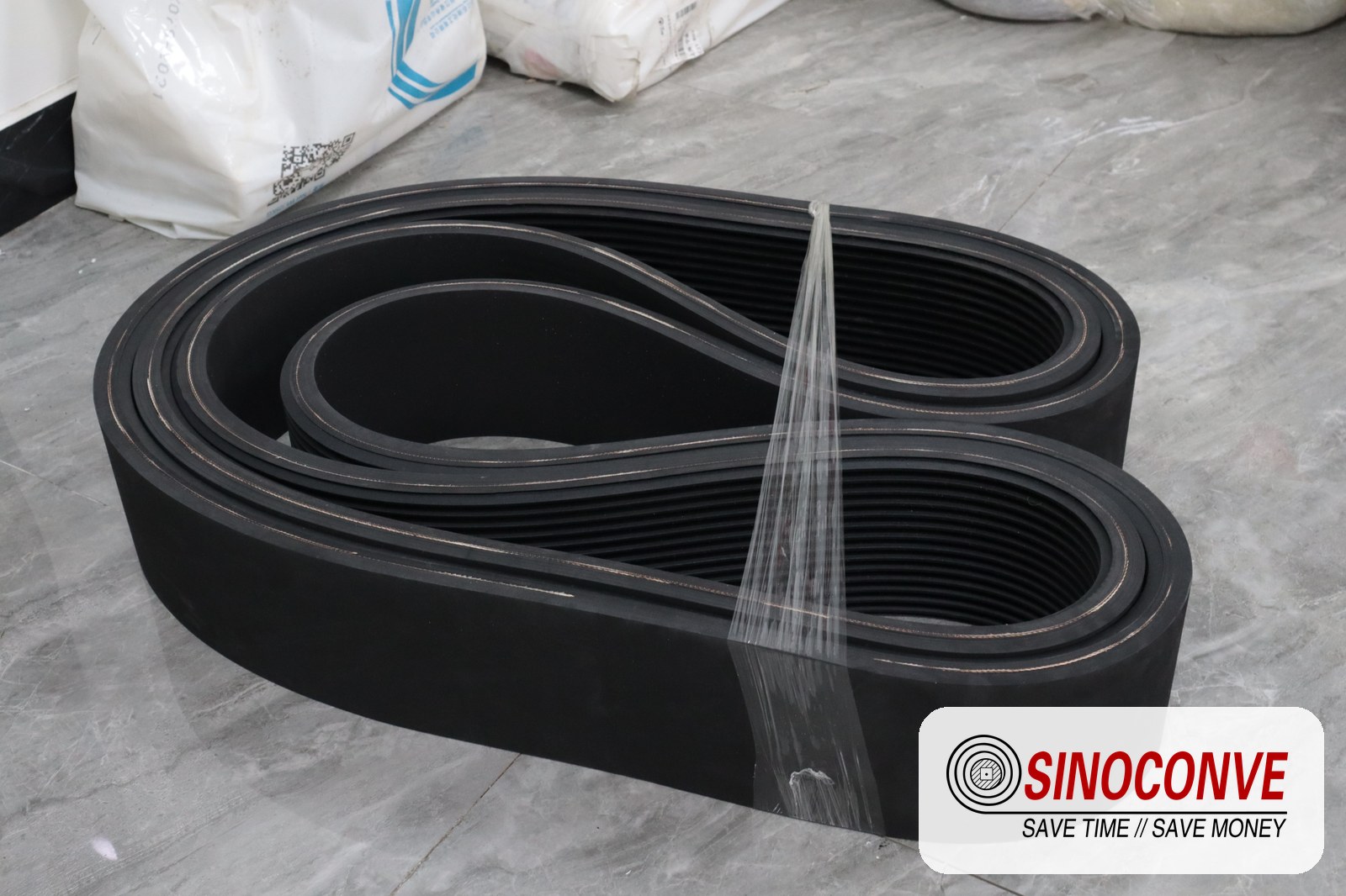 ribbed belts laid out on a workshop floor