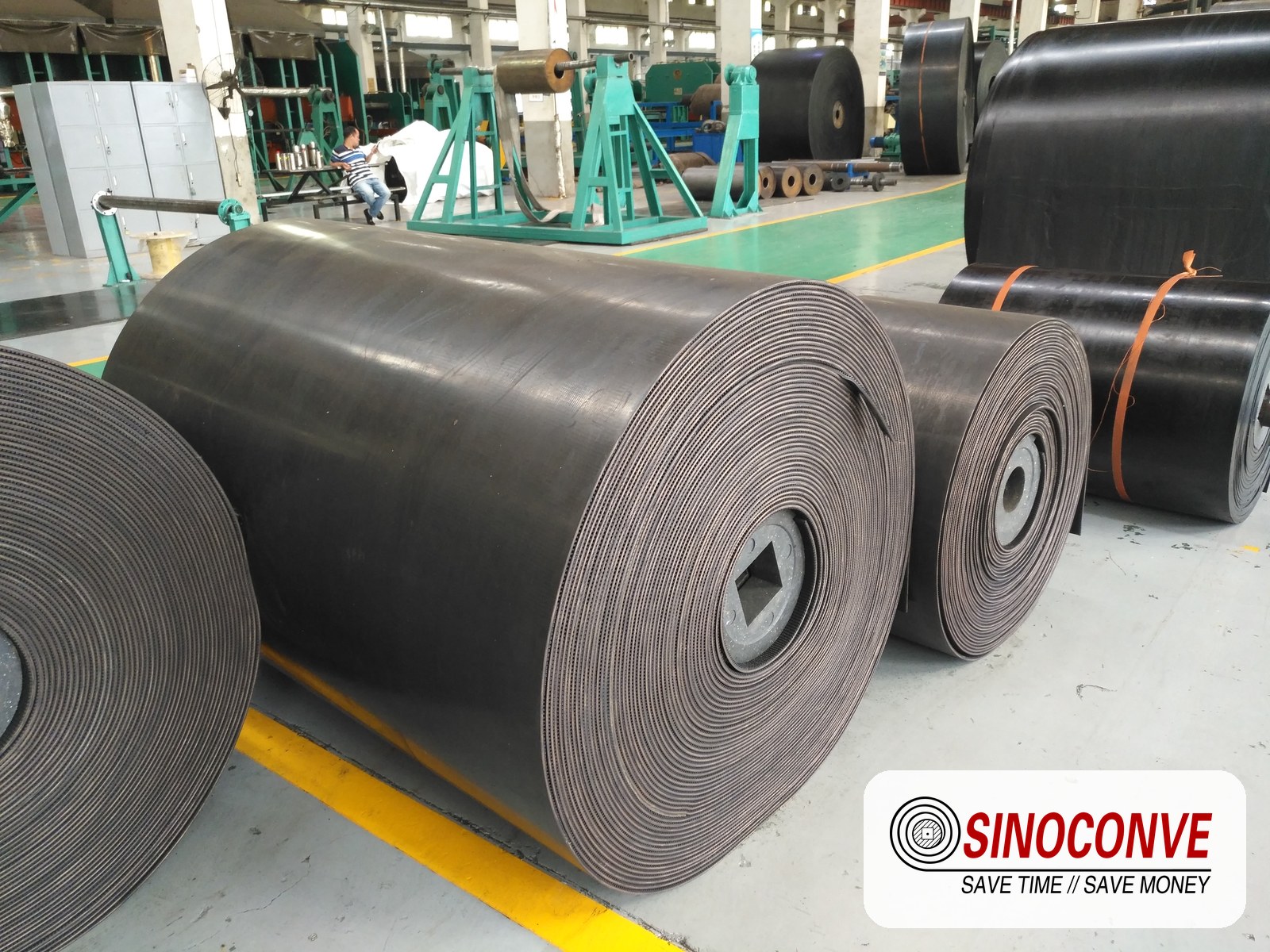 conveyor belt rolls stored in a yard