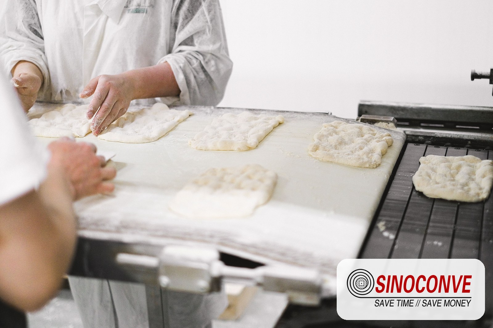 worker inspecting produce on a food processing line