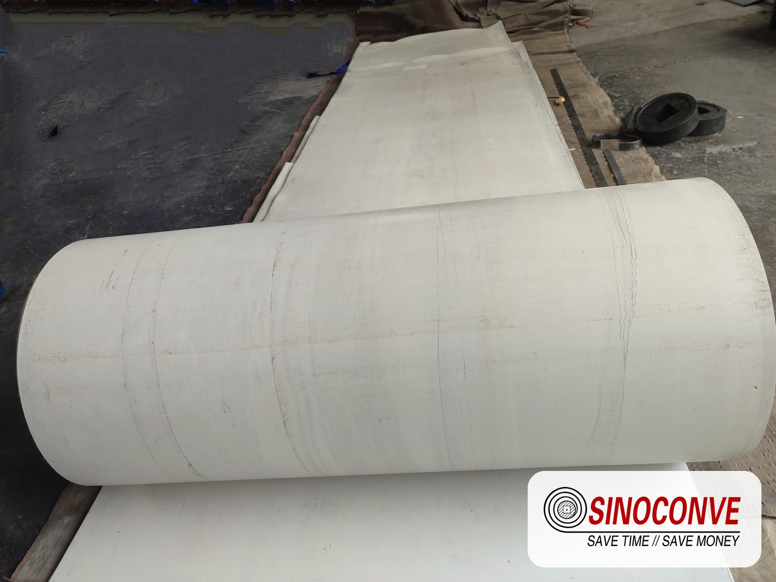white conveyor belt roll in a workshop