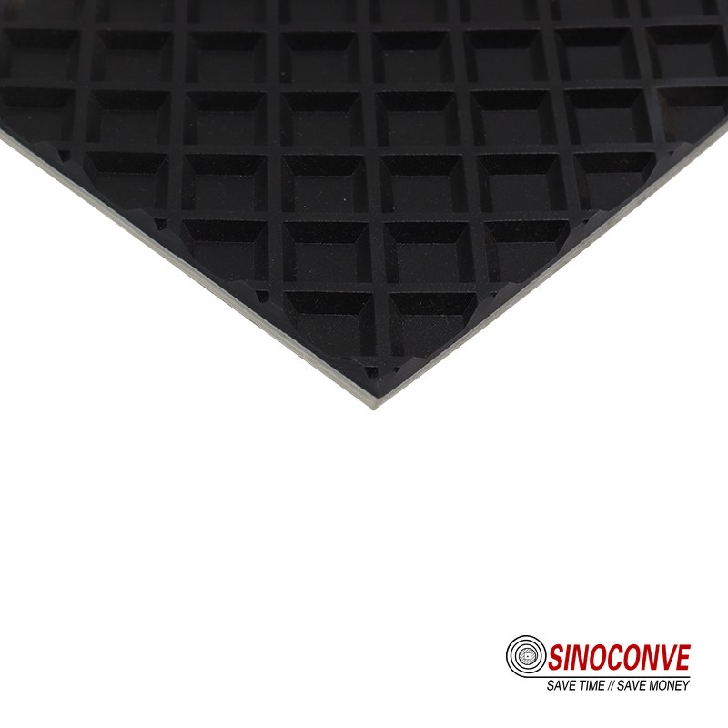 black conveyor belt with a recessed square grid surface