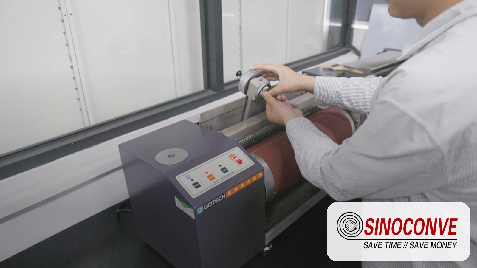 operator running an abrasion resistance test in the laboratory