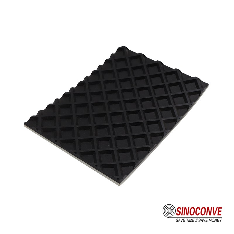 plastic belt surface with a moulded raised square grid pattern