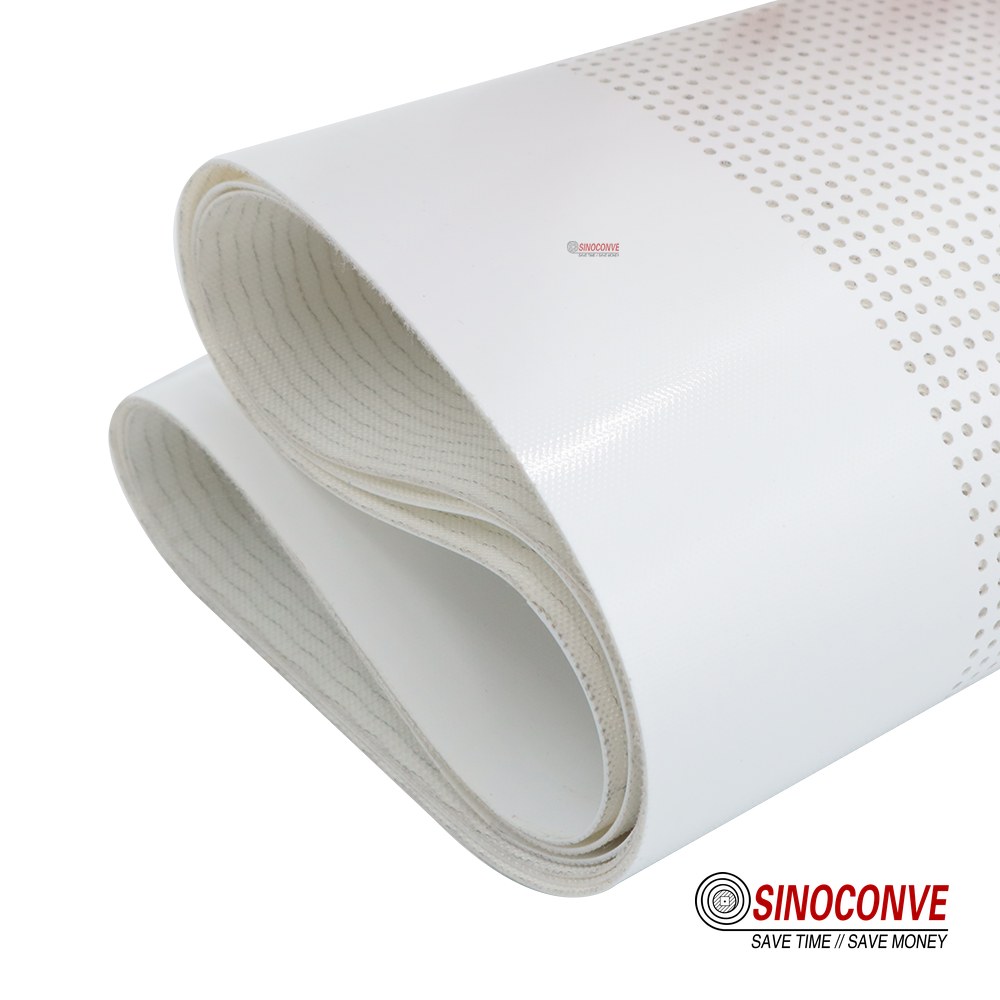 Close view of the textured cover on a seafood processing conveyor belt for wet fish handling