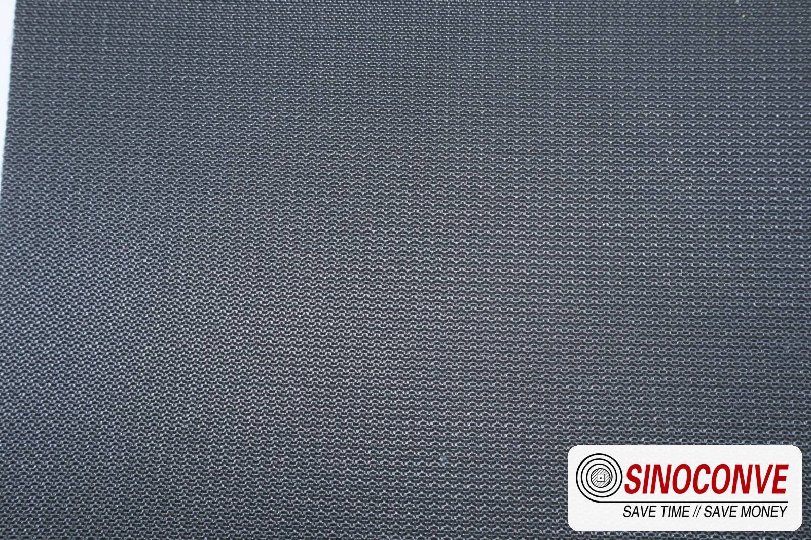 Black fine-ribbed rough top gypsum board conveyor belt surface shown across the full frame