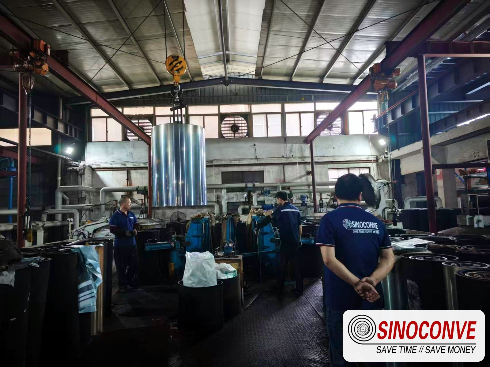 Factory lifting area where a gypsum conveyor belt is prepared and inspected before dispatch