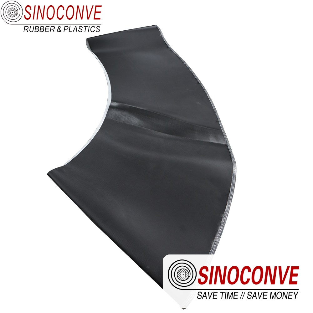 Curved section of a black PVC belt for an airport baggage conveyor belt