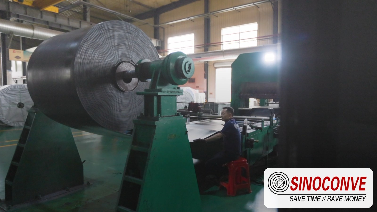 Wide belt roll on an uncoiler in the plant that builds tyre recycling conveyor belts